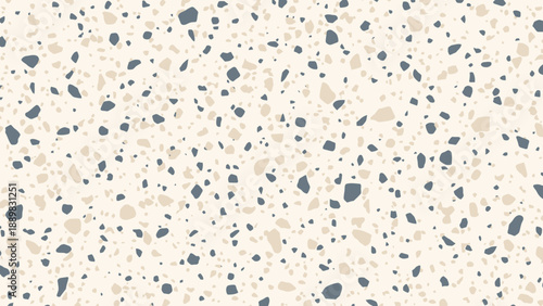 Close-up of terrazzo flooring showing speckled chips and neutral mineral aggregate in a modern decorative pattern.