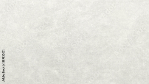 soft white cotton fabric texture closeup revealing delicate knit weave and subtle fibrous details in serene neutral palette for minimalist design backgrounds