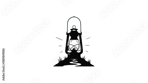 Vintage oil lantern illuminating a path through grass at night