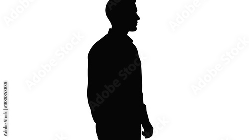 Man standing alone in a contemplative pose, captured from a side view in a minimalist silhouette style