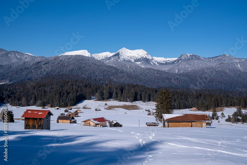 Snow-covered Buckelwiesen near Mittenwald set within the winter alpine mountains.
