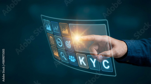 A persons hand touches a bright glowing virtual screen showing business data graphs icons and KYC text in a dark high tech setting representing digita