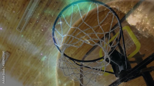 Basketball entering frame and pushing net, hoop rim bouncing, overlays glowing and showing swish
