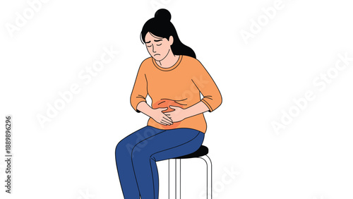 Woman sitting on a stool and holding her abdomen, experiencing pain from menstrual cramps, indigestion, or a stomach ache.