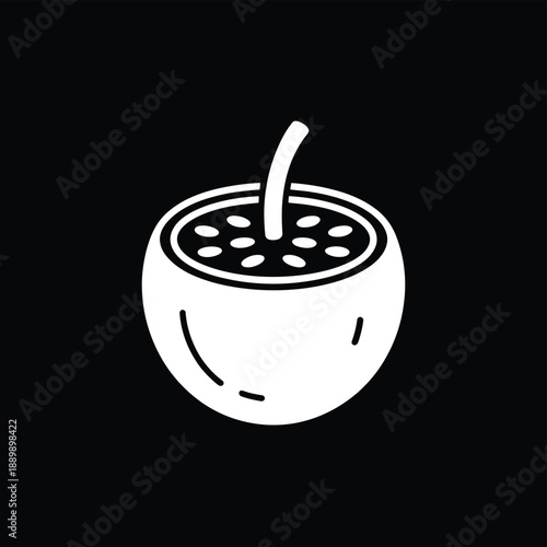 A refreshing exotic drink in a coconut shell with a straw and garnish simple modern design