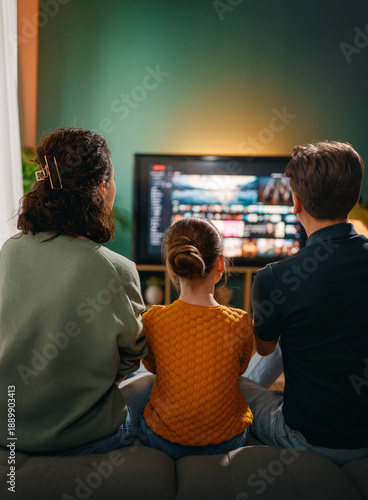 family watching  TV at home