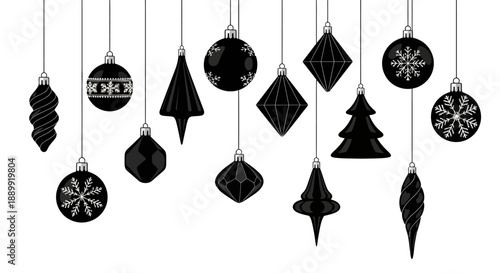 Elegant monochrome christmas ornaments hanging against a white backdrop offering minimal festive