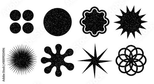 Collection of abstract black shapes and designs on a plain background from a straightforward viewpoint