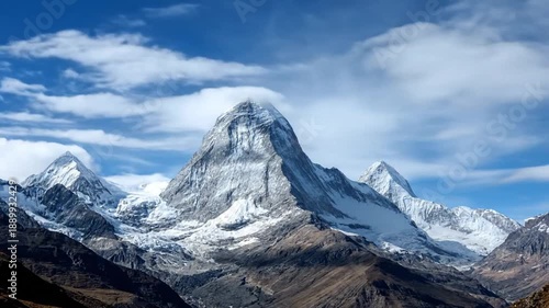 Snowcapped Mountain Peaks Under Blue Sky.
