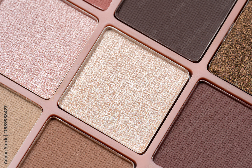 Fototapeta premium Cosmetics. Eyeshadow palette featuring a variety of colorful matte and shimmer shades. Essential cosmetic product for professional makeup artists, beauty tutorials, and fashion industry themes
