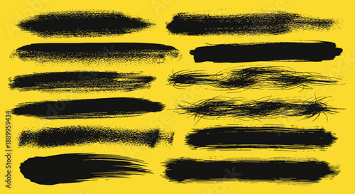 Set of Black Grunge Brush Strokes and Paint Splatter Textures on Yellow Background