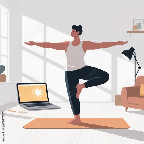 A man practices the yoga tree pose in his modern living room while following an online fitness tutorial on a laptop, emphasizing home wellness and balance.