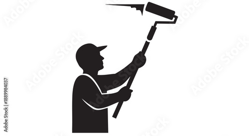 Painter applying paint with roller from elevated viewpoint in industry setting