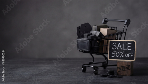 Cluttered shopping cart with sale sign on wooden box in dimly lit environment