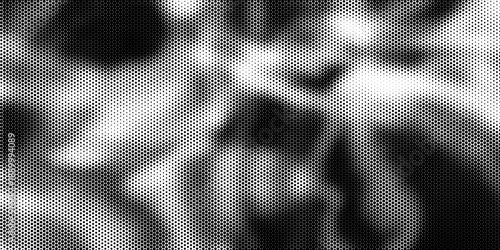 Halftone crumpled paper texture with wite a dotted, rough, and wrinkled surface. Black creased sheet background in comic pop-art style, featuring grainy folds and gritty distressed details.