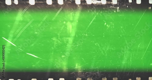 film strip transition, with chroma key green screen background, effect of old film rolling with details, scratches and grain, vintage strip intro