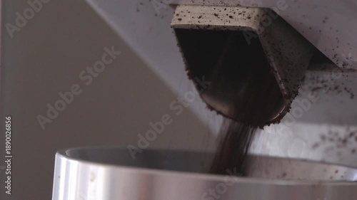 Wallpaper Mural 4K coffee grinder is pouring coffee into a cup coffee is dark and rich and the grinder is full. Torontodigital.ca