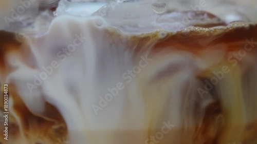 Wallpaper Mural 4K Abstract fluid motion of brown and golden liquid swirling in coffee creating soft organic patterns. Concept of creativity, calm flow, artistic texture, movement background. Torontodigital.ca