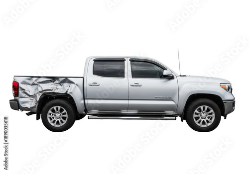 Damaged silver pickup truck with rear fender dent, crashed modern 4x4 vehicle isolated on white, automotive insurance claim and car accident concept
