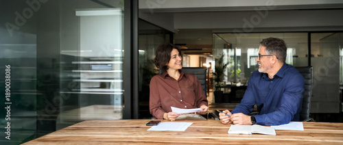 Photography Happy professional executives team discussing papers working together in office