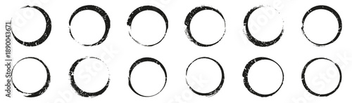 Grunge circular brush frames set in black. Rough ink ring borders with distressed texture