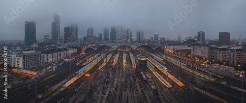 An aerial photograph of Frankfurt's main train station on a gloomy, foggy day
