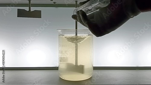 Adding Coagulant Chemical to Water Sample During Jar Test Rapid Mixing at 180 RPM