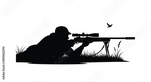 Hunter aiming a rifle with a bird flying dramatic silhouette