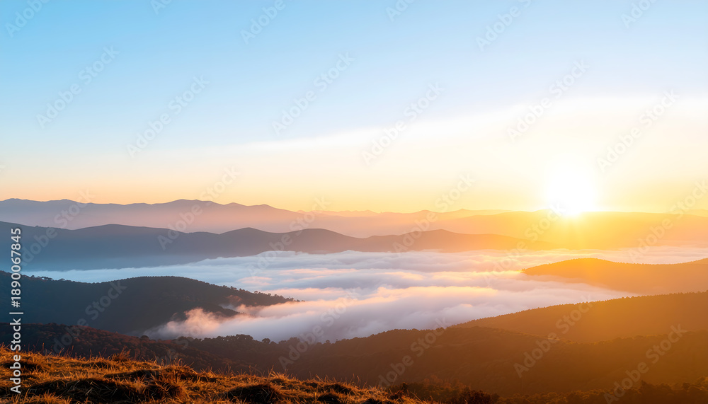 Fototapeta premium Soft fog over mountain ridges in early morning light