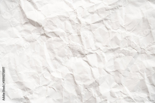 Grunge wrinkled white color paper textured background with copy space. Use for decoration or layer