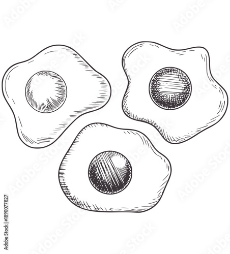 Black and of three fried eggs with visible yolks food