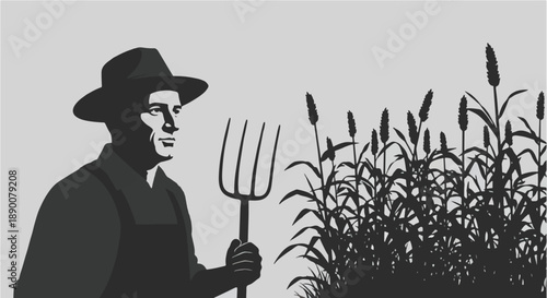 Farmer with pitchfork standing in wheat field