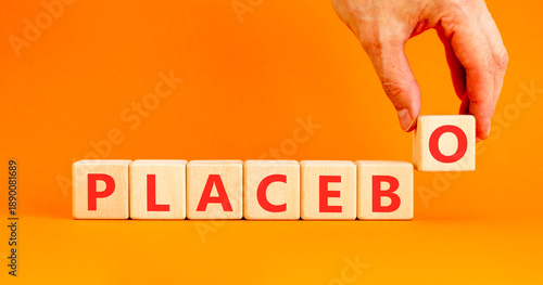 Placebo word medical symbol. Concept word Placebo on beautiful wooden blocks. Beautiful orange background. Doctor's hand. Business placebo word medical concept. Copy space.