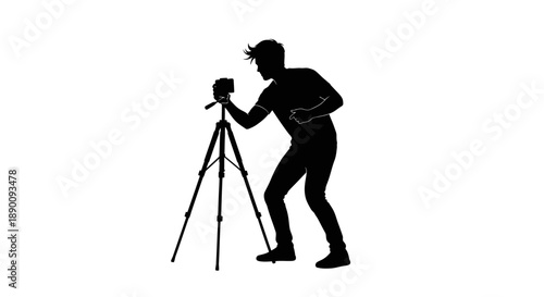 Silhouette of a photographer at work with a tripod and camera