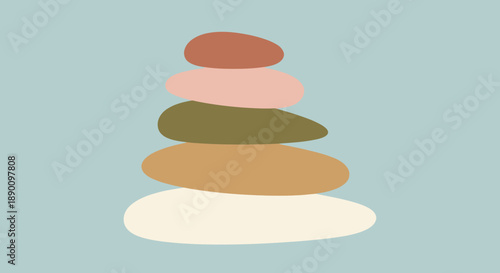 Stack of balanced stones in various earthy tones on a serene background.
