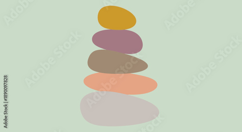 Stack of colorful stones on a light green background.