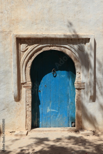 Wallpaper Mural Blue Wooden Door with Sculpted Frame in Erriadh, Djerba, Tunisia Torontodigital.ca