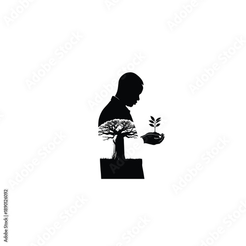 Man holding seedling next to baobab