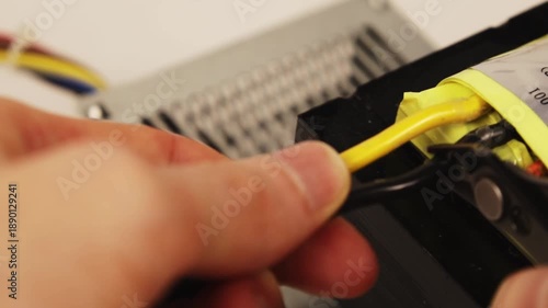 electrician cutting power wires