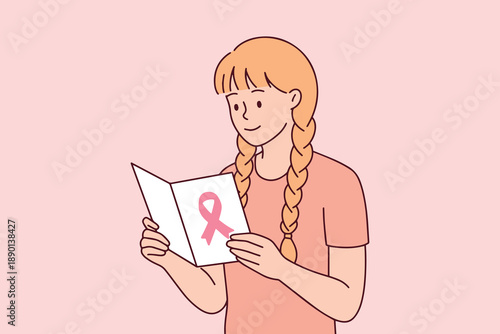 Young blonde female with braids studies a medical brochure about breast cancer screening. Education and awareness are key to early detection and successful treatment of the disease.