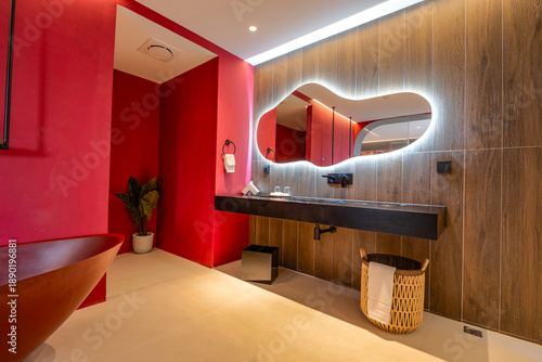 Red toilet room. Interior with monochromatic design.