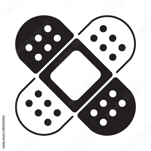 Four adhesive bandages arranged in a symmetrical cross formation black and white
