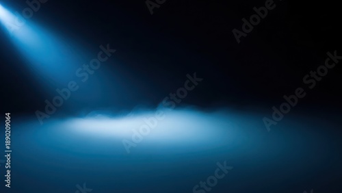 Mysterious blue spotlight beam illuminating foggy atmosphere