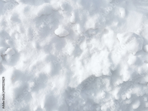 Fotografie White snow texture background with lumps