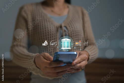 Foto Conducting financial transactions and investments on online platforms with modern and secure technology, the young woman used her mobile phone to activate credit card notifications