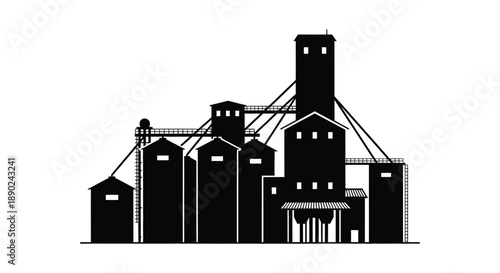 A stark black silhouette depicts an industrial complex of grain elevators and supporting structures creating a dramatic silhouette high quality professional