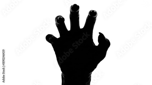 Creepy Black Silhouette of a Monstrous Hand with Sharp Claws Reaching Up