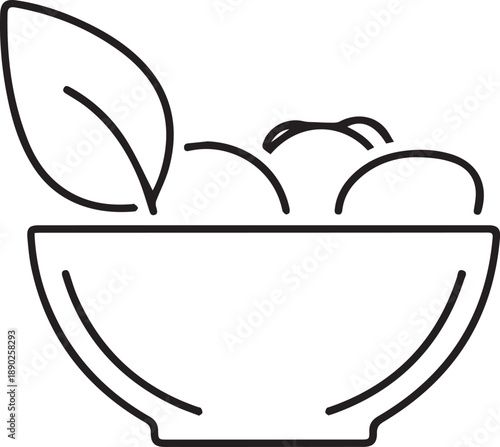 Fresh fruit bowl with leafy green garnish on white