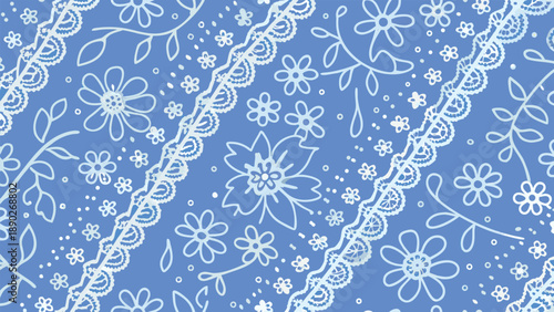 Delicate white floral pattern on blue background with intricate lace design and scattered flowers
