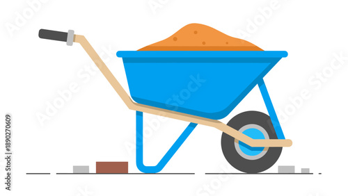 Blue wheelbarrow filled with sand on a construction site